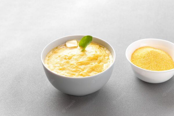 traditional italian dish is polenta plate is gray with corn porridge polenta with piece b 235573 665 Corn Porridge